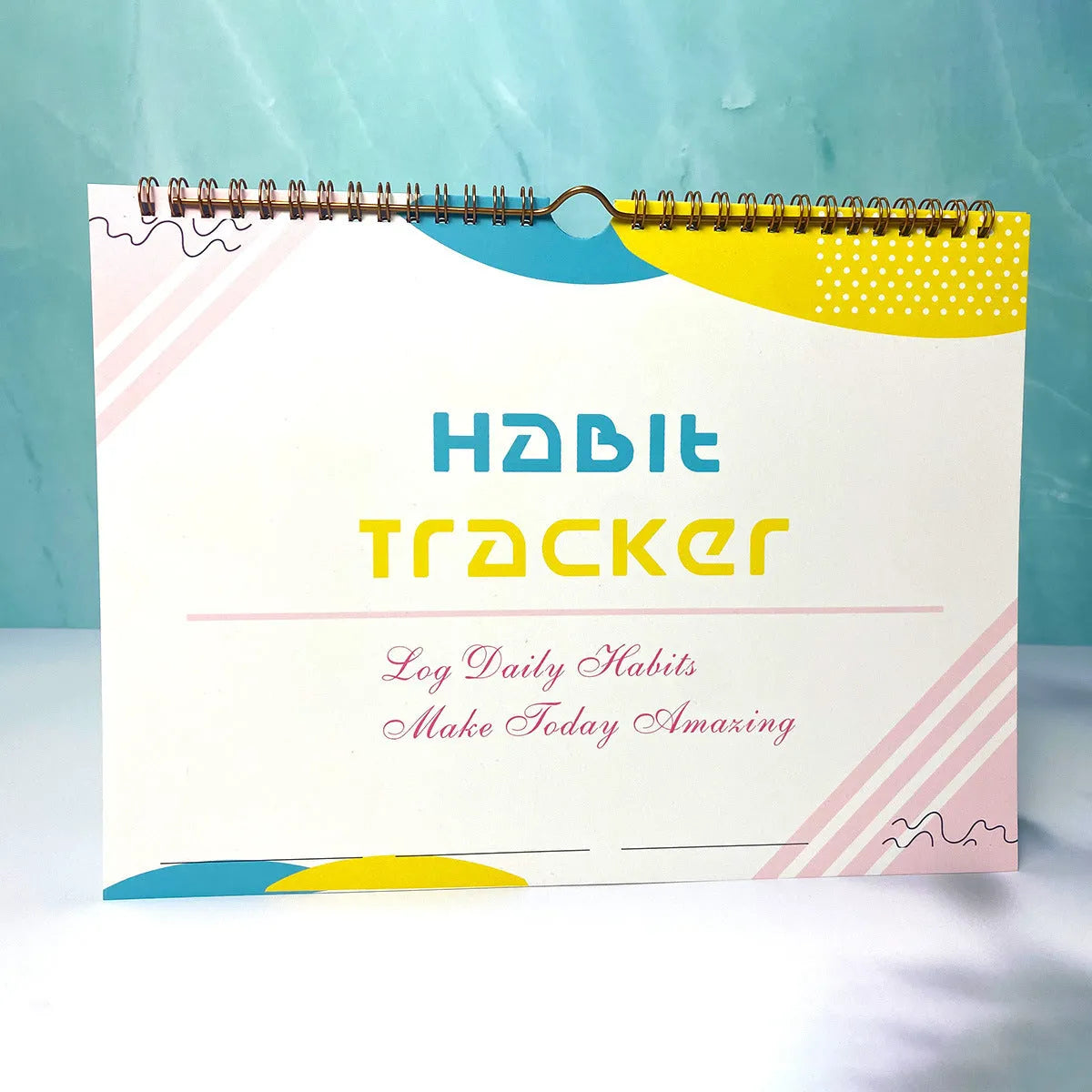 A4 habit tracking planner showing pink white cover with 12 internal pages for schedule recording