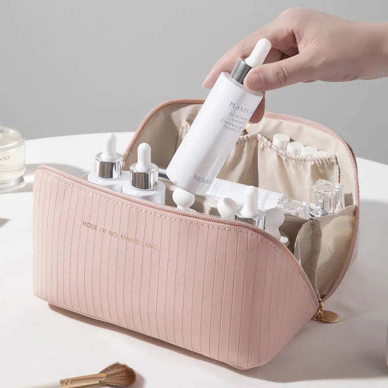 Vertical pattern pillow makeup bag in PU leather showing cubic shape and large storage capacity