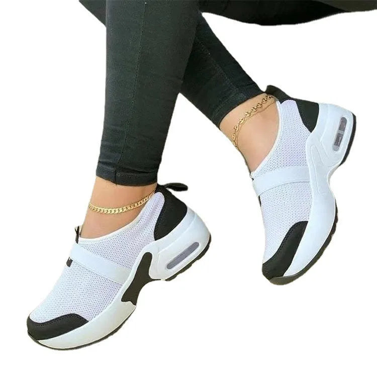 Women's white mesh sneakers with rubber soles and colour stitching details