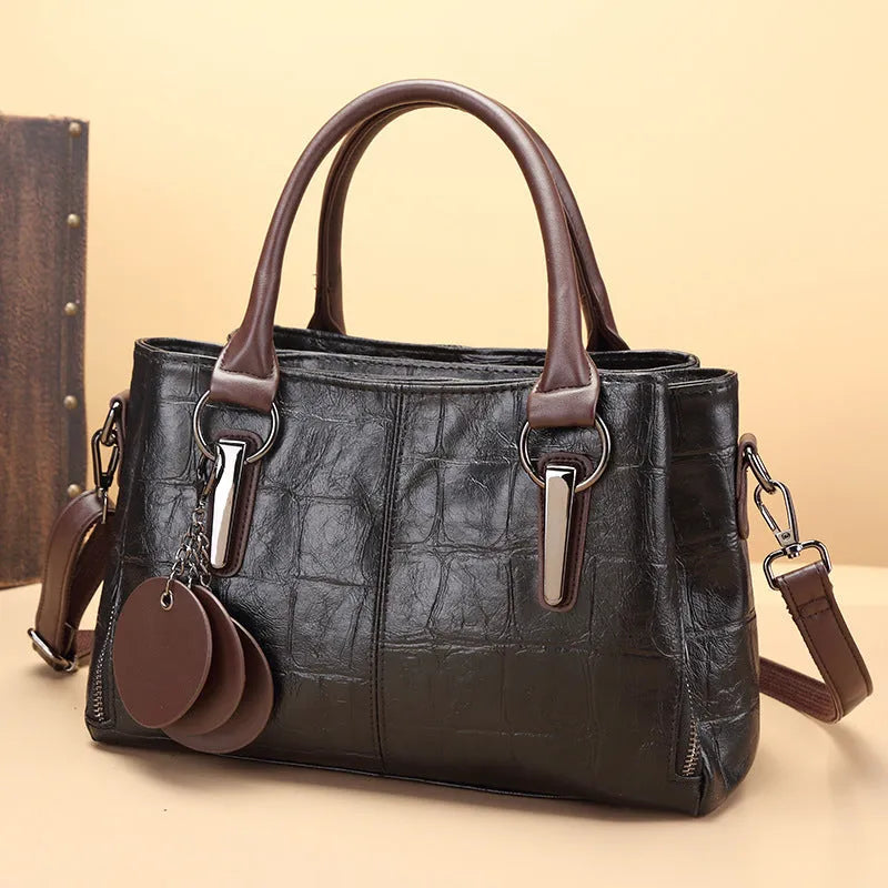 Horizontal square PU leather shoulder bag with contrasting sewing thread detail and organised interior compartments