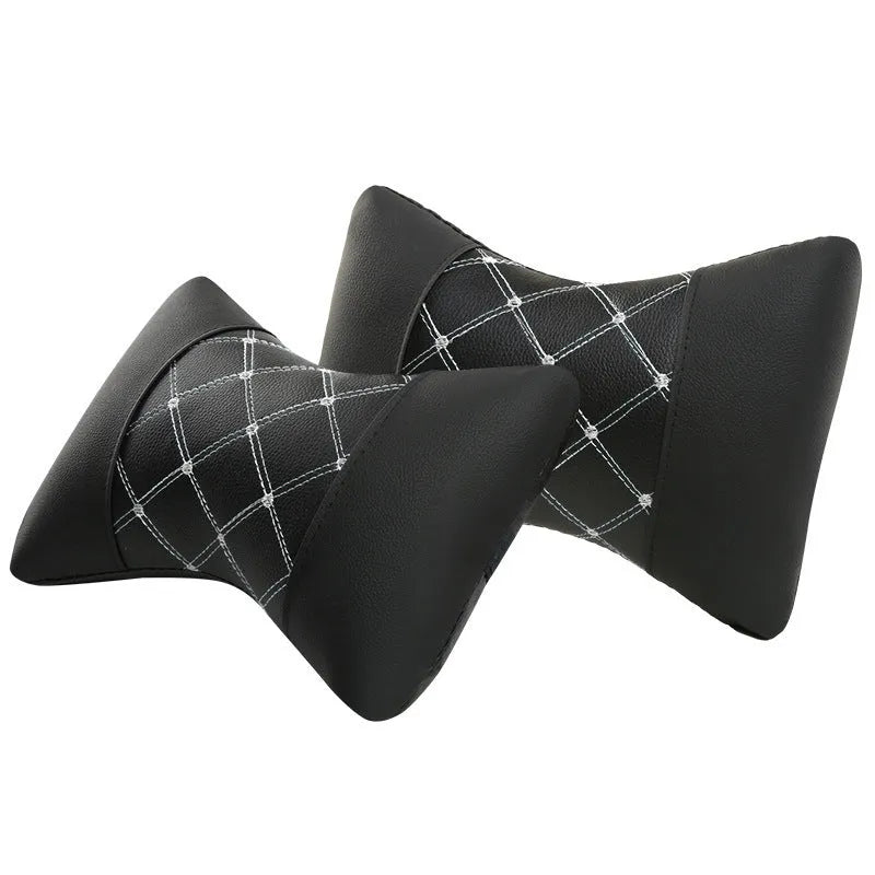 Black quilted car headrest neck pillow with diamond pattern and contrasting stitching