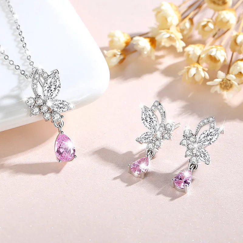 Close-up of women's butterfly stud earrings in sterling silver with clear rhinestone details.