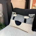 Grey Schnauzer design dog cushion pillow on a sofa, measuring 50cm long