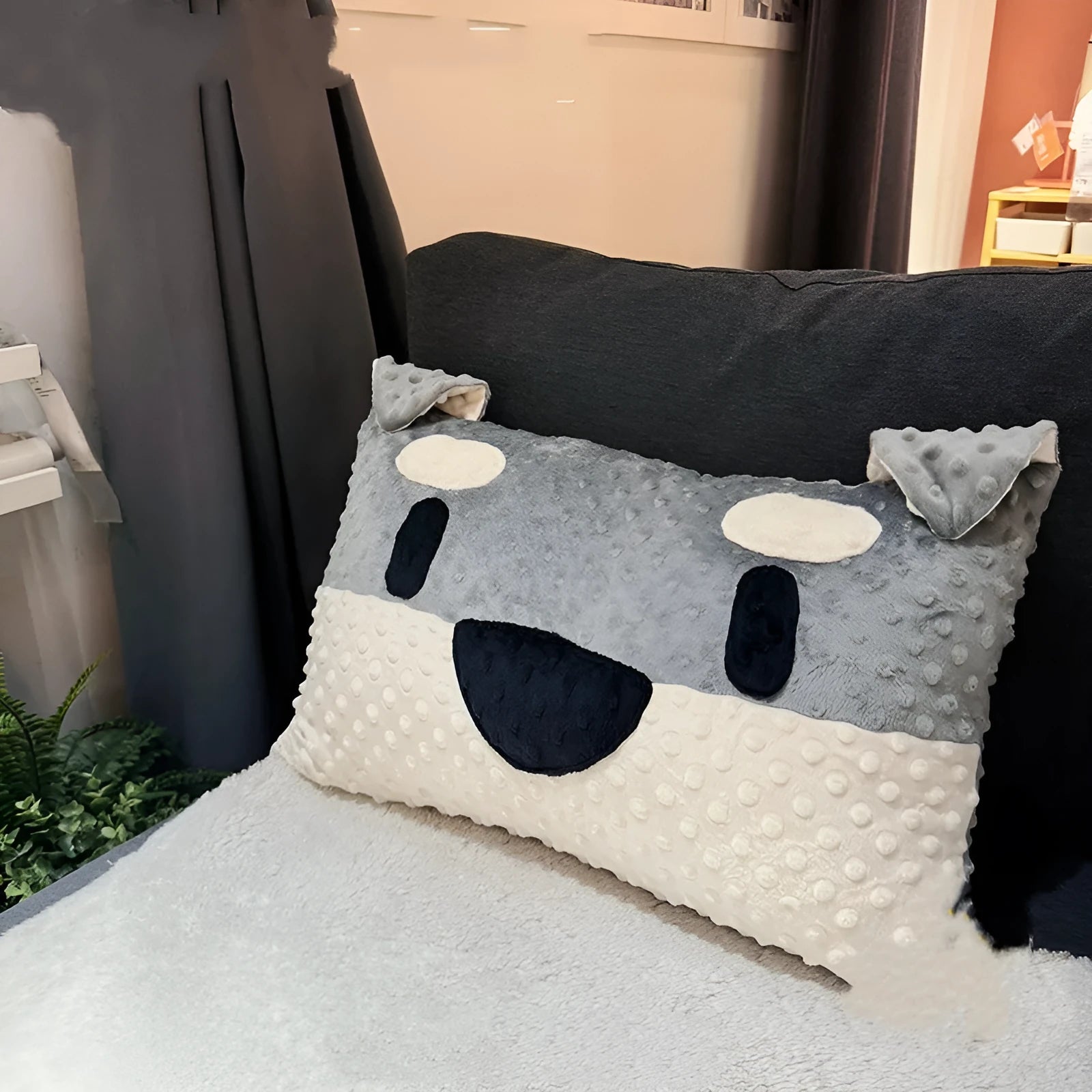 Grey Schnauzer design dog cushion pillow on a sofa, measuring 50cm long