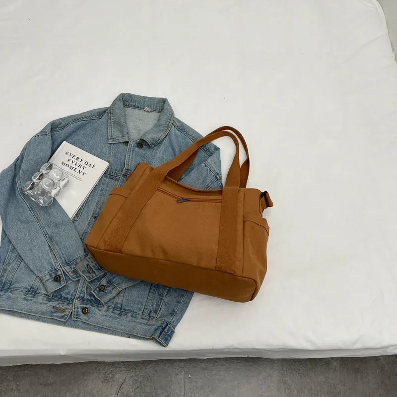 Large capacity polyester canvas shoulder tote bag in solid colour with phone compartment