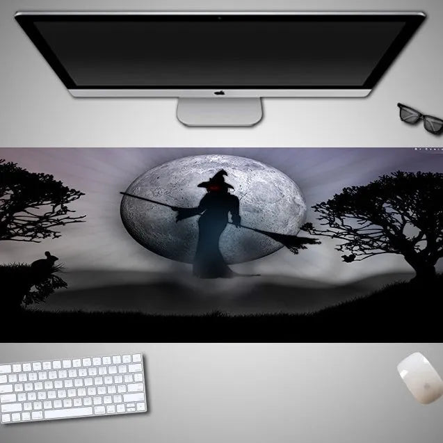 Oversized Halloween-themed gaming mouse pad with non-slip base on a desk.