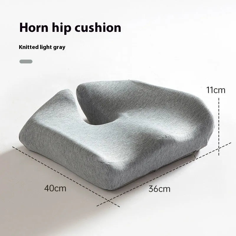 Dark grey memory foam office chair cushion with lumbar support, shown on a black desk chair.