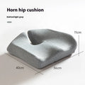 Dark grey memory foam office chair cushion with lumbar support, shown on a black desk chair.