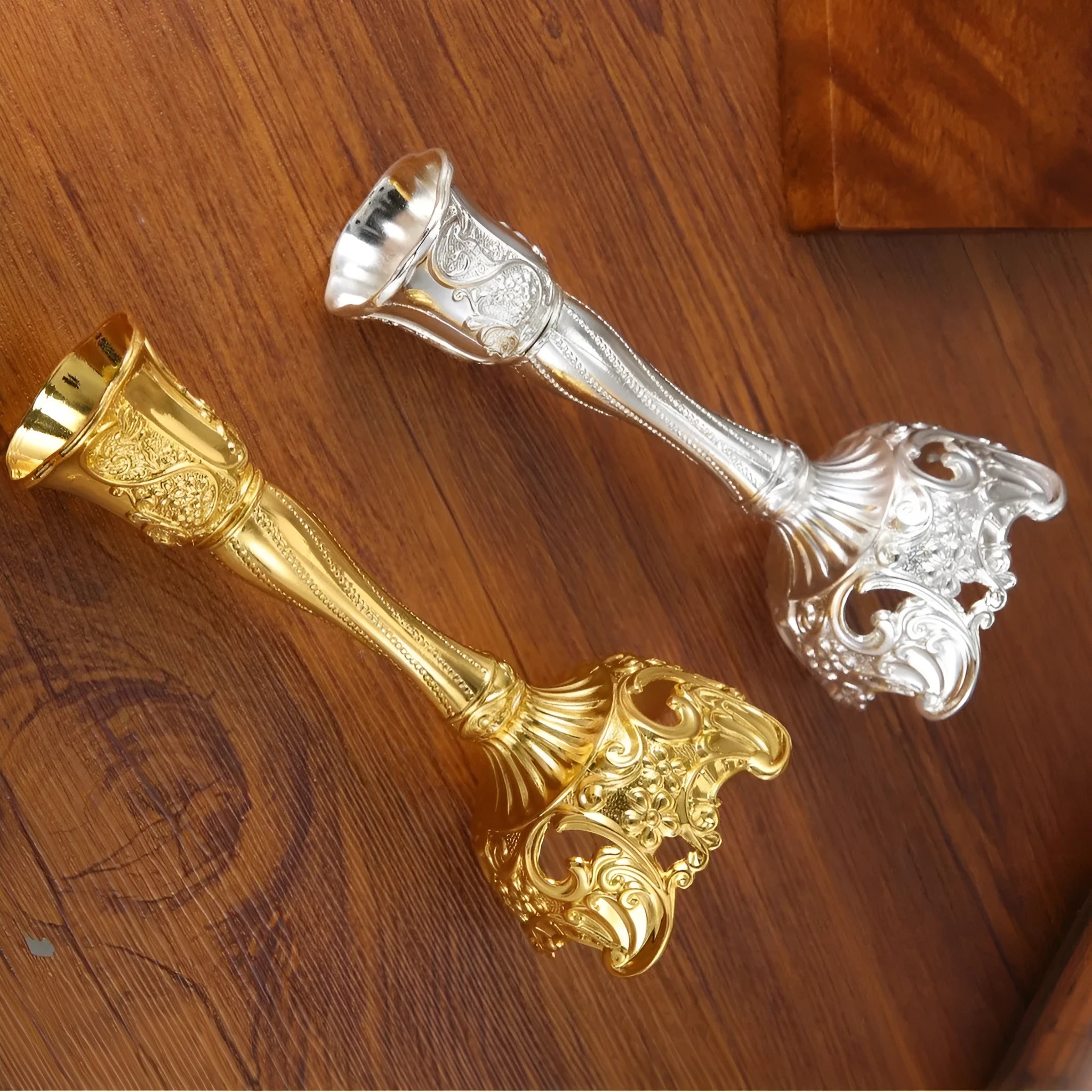 Small retro metal candlestick ornament in gold finish on a wedding table setting