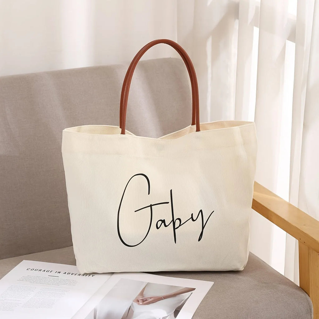 Natural cotton canvas tote bag with zip closure and double shoulder straps in beige white colour