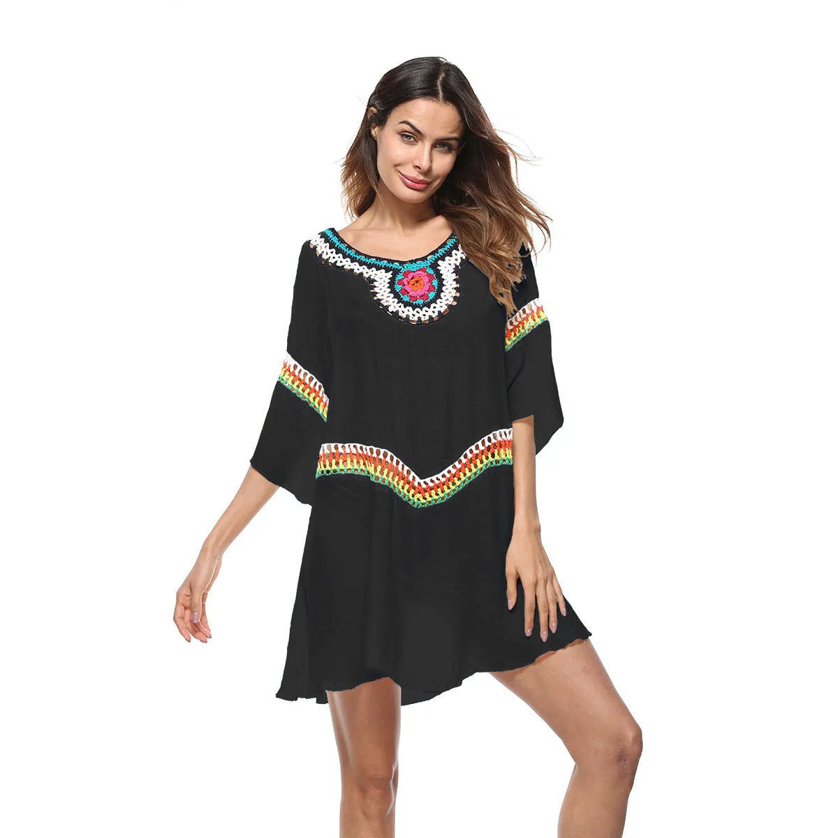 Crocheted white ethnic-style beach cover-up for women, shown as sun protection clothing.