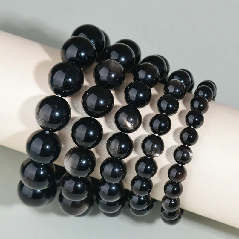 Hand-woven round obsidian crystal couple bracelet set showing ethnic-style design with multiple bead size options