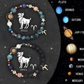 Set of two natural stone beaded bracelets showing different zodiac sign designs.