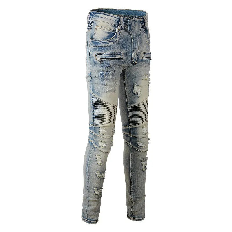 Light blue men's slim fit distressed jeans with hand-frayed details on a mid-waist, showing a zipper fly and straight leg cut.