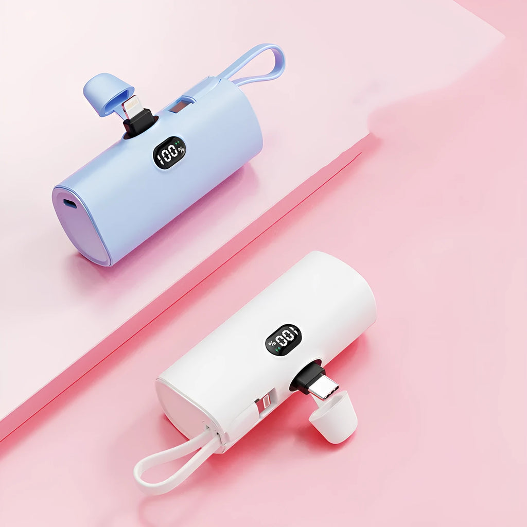 Compact capsule-shaped power bank with digital display and wireless charging surface in multiple colour options