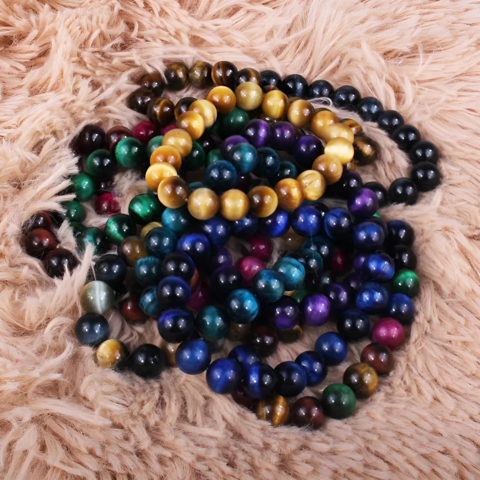 Natural tiger eye crystal bracelet with round beads in choice of colour and 6mm, 8mm, 10mm, or 12mm sizes.