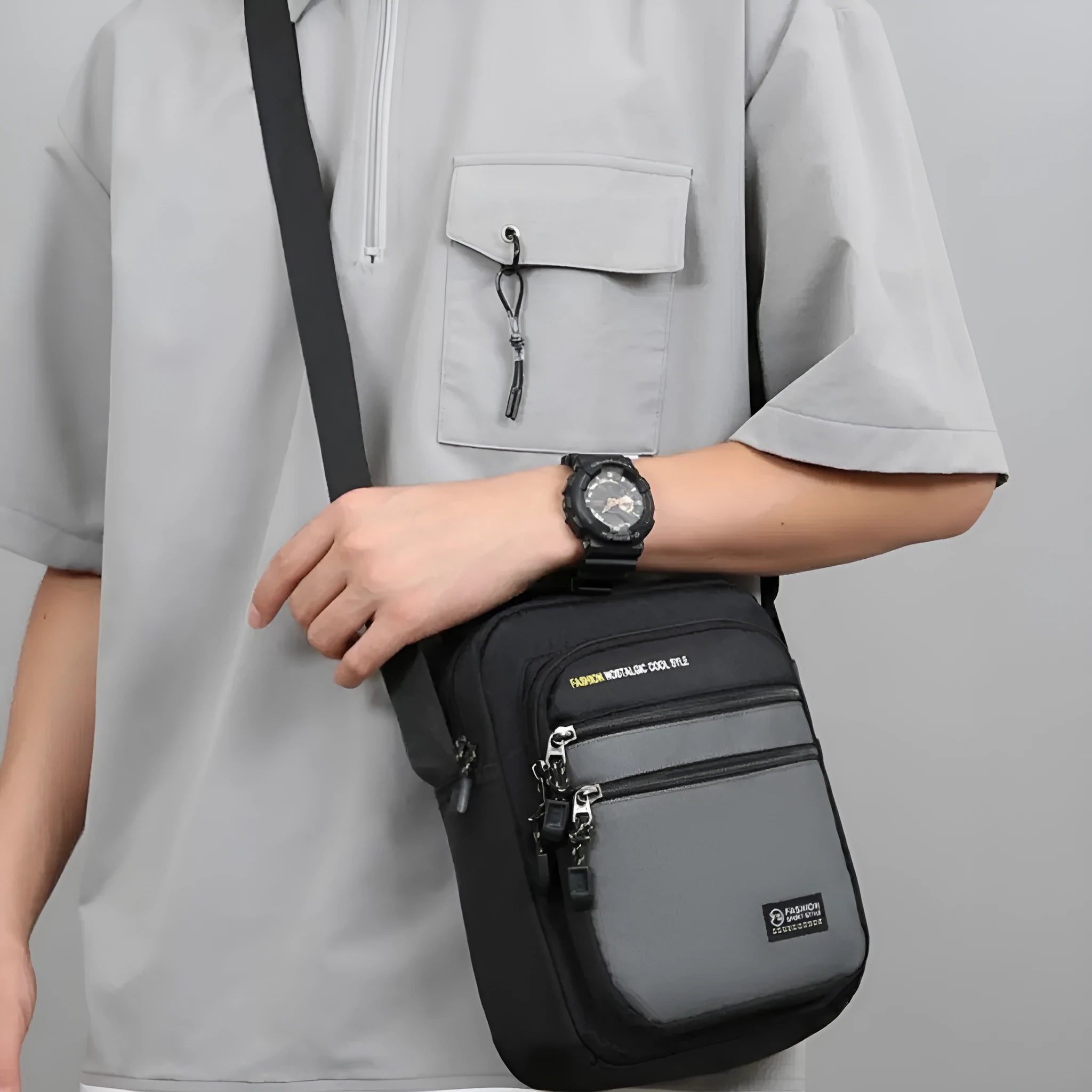 Men's nylon crossbody bag in solid colour with multiple pockets and adjustable shoulder strap