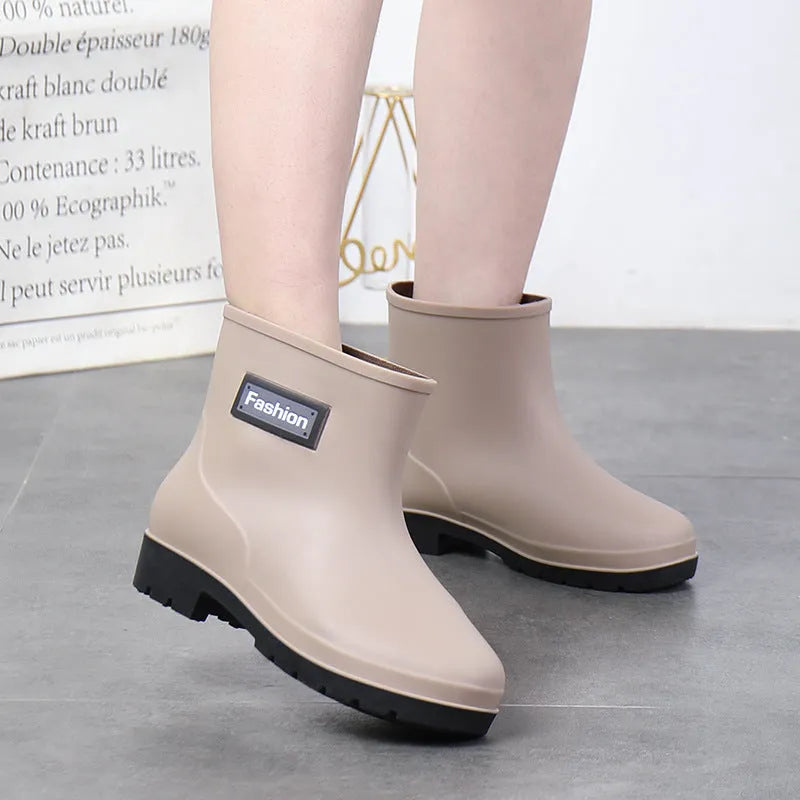Women's mid-calf PVC rain boots in black colour with low heel