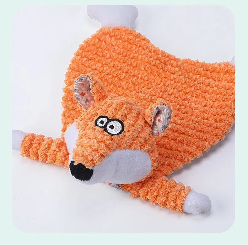 Brown plush fox dog toy with squeaker on a grey background.