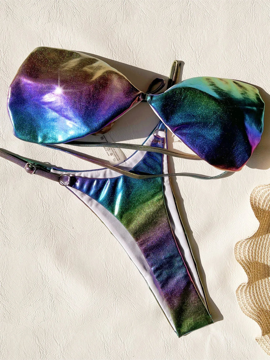 Women's purple gradient bikini swimsuit set on a mannequin, showing the colour transition.