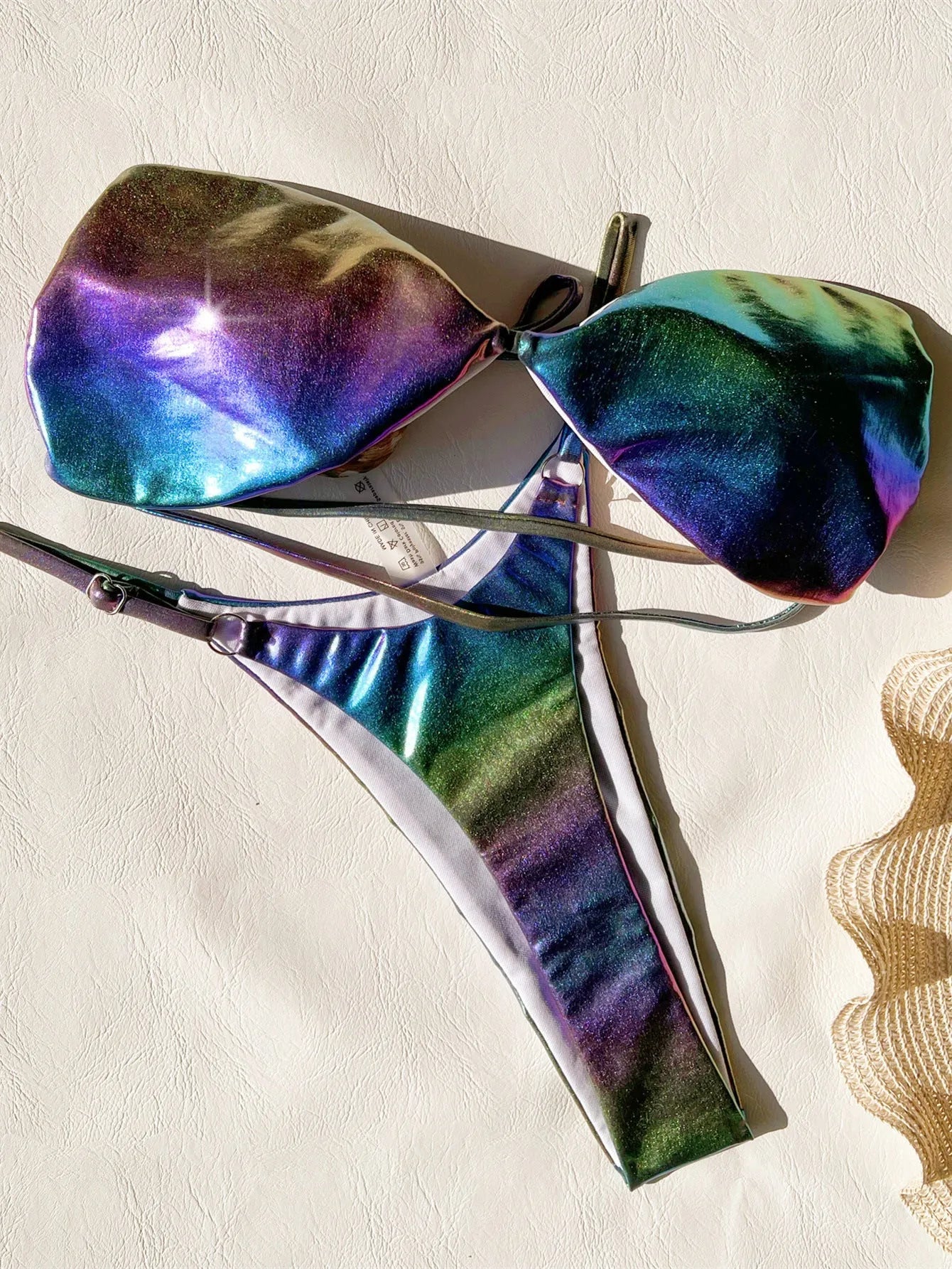 Women's purple gradient bikini swimsuit set on a mannequin, showing the colour transition.