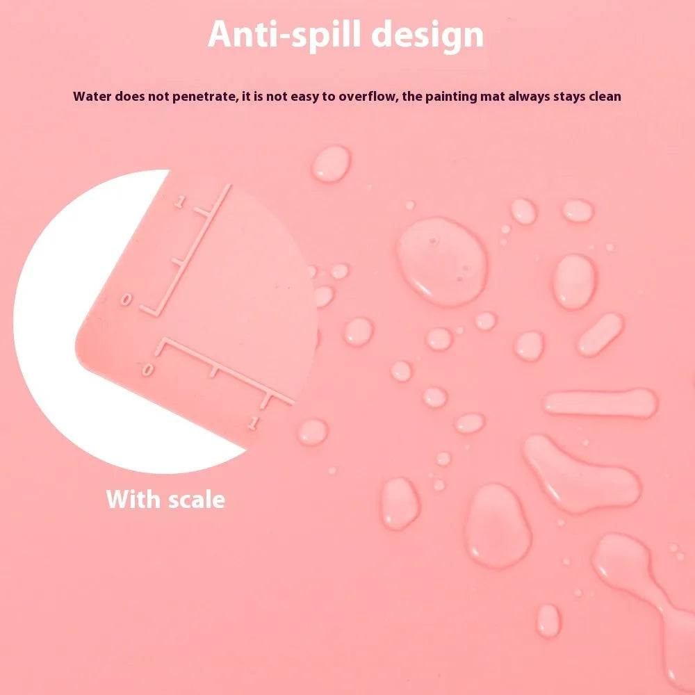 Light blue silicone painting mat with two integrated bowls for paint mixing, measuring 50cm by 40cm.
