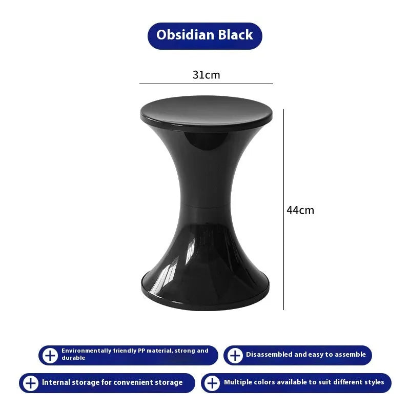 Hourglass-shaped plastic stool in green for changing shoes, used by an adult and child.