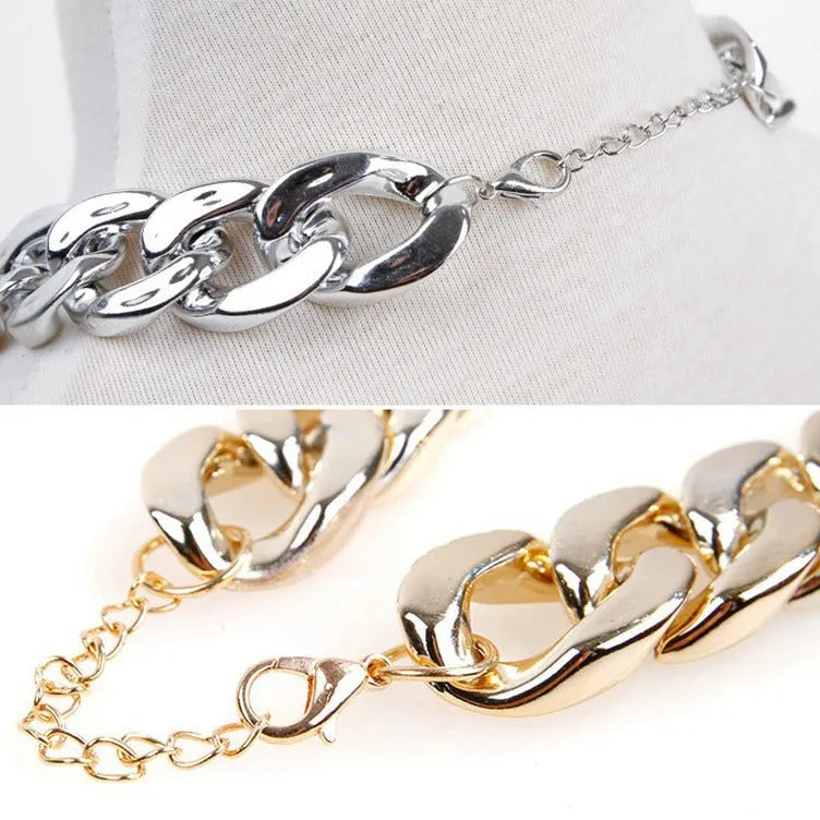 Geometric twisted chain dog collar with buckle on a white background, shown in a gold colour.