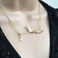 A lightweight alloy necklace with a simple black cat pendant, shown in gold and silver finish options.