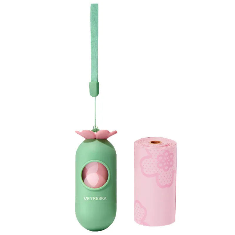 Portable plastic capsule dispenser for scented dog poo bags in strawberry, orange, and cherry blossom designs.