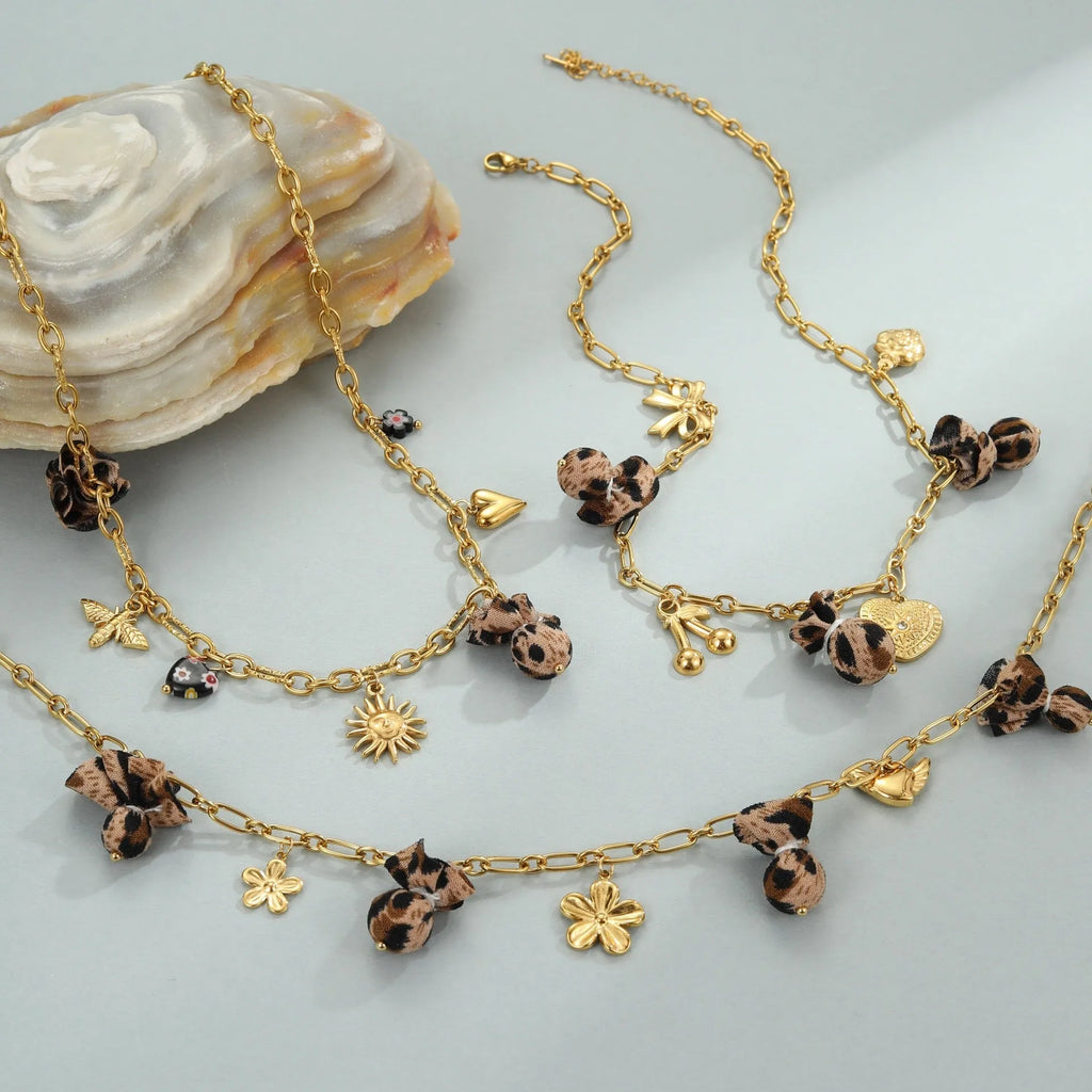 Women's stainless steel necklace with leopard pendant and love heart flowers design