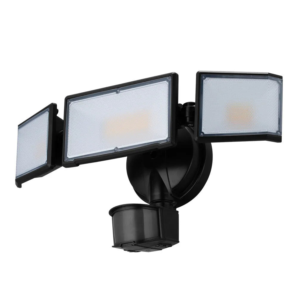 White or black outdoor LED flood light with motion sensor for wall or ceiling mounting.