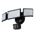 White or black outdoor LED flood light with motion sensor for wall or ceiling mounting.