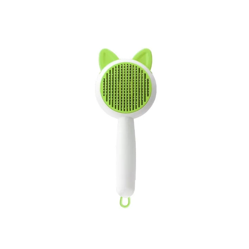 Self-cleaning pet grooming brush with stainless steel teeth and TPR massage nodes in greenish white colour.