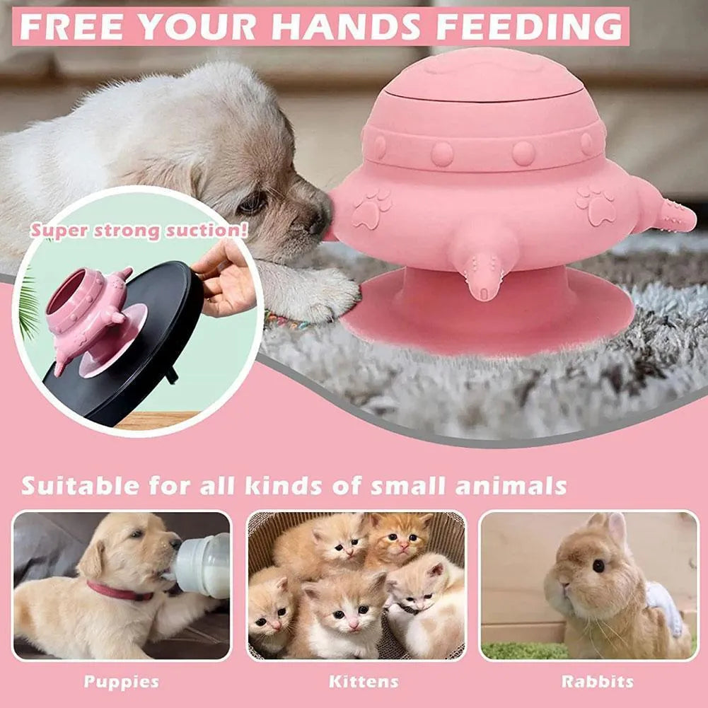 Pink silicone pet nursing milk feeder bowl with four pacifiers on a flat base.