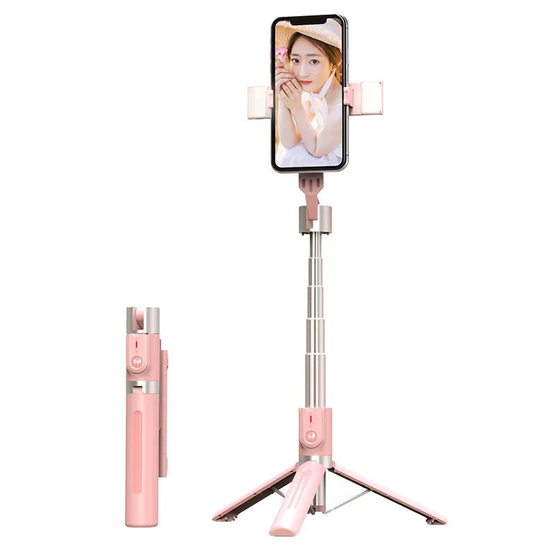 Bluetooth selfie stick with double fill light extended on desktop showing aluminium alloy arm and stand base