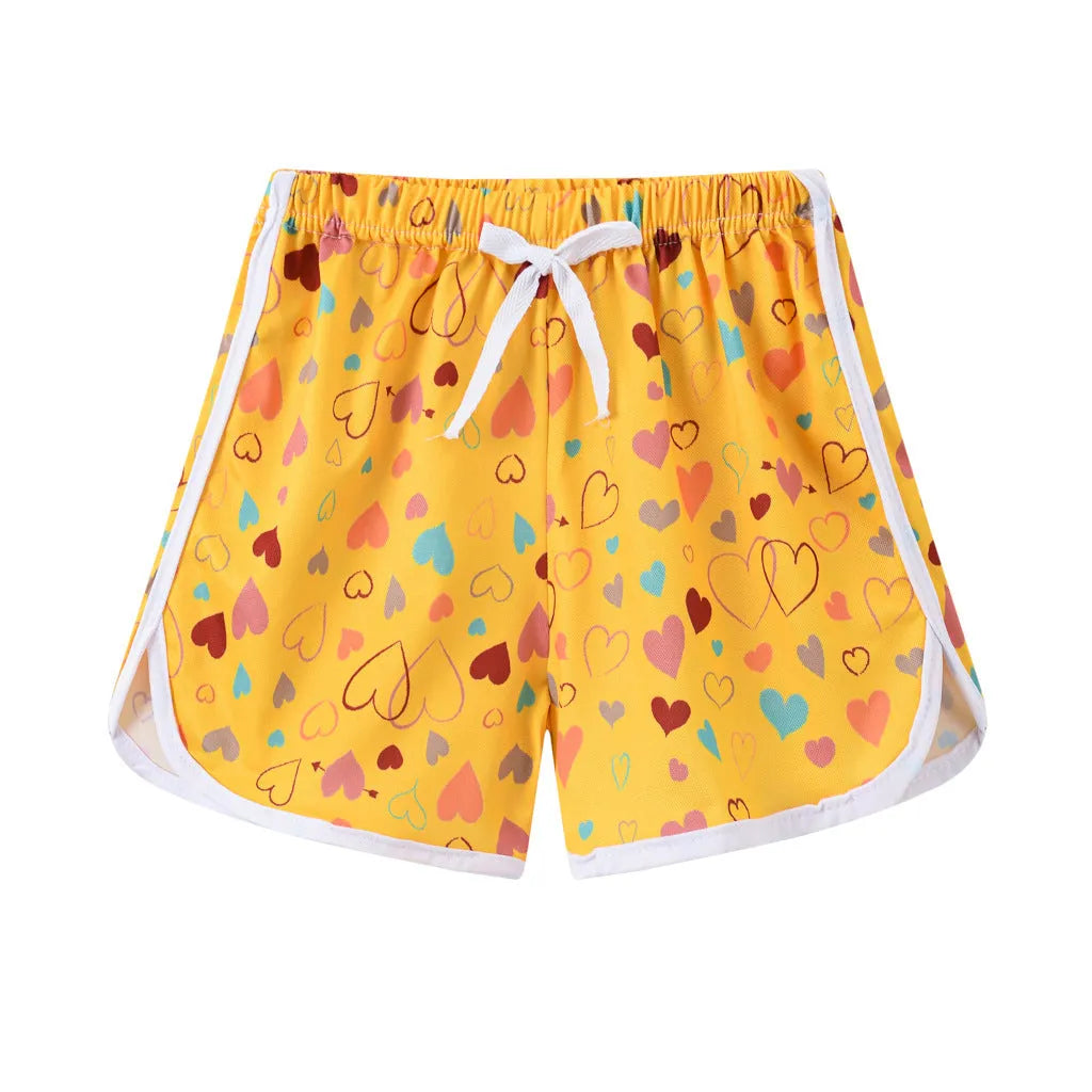 Children's casual polyester shorts in assorted colours and prints like pineapple, kitten, and stripes for beach wear.