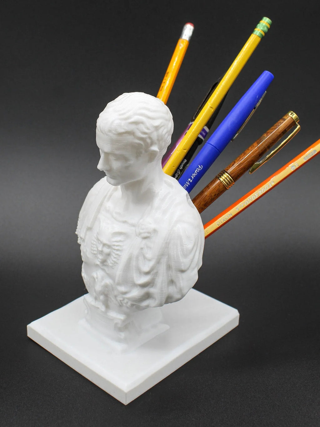 White American creative character model synthetic resin pen holder on a desk