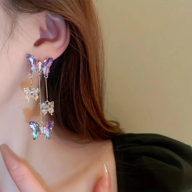Silver needle crystal flowers butterfly tassel earrings in blue purple colour with electroplated alloy construction