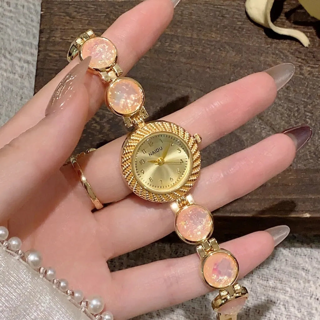 Women's quartz watch with 25mm round dial and zinc alloy case in one of six colours.