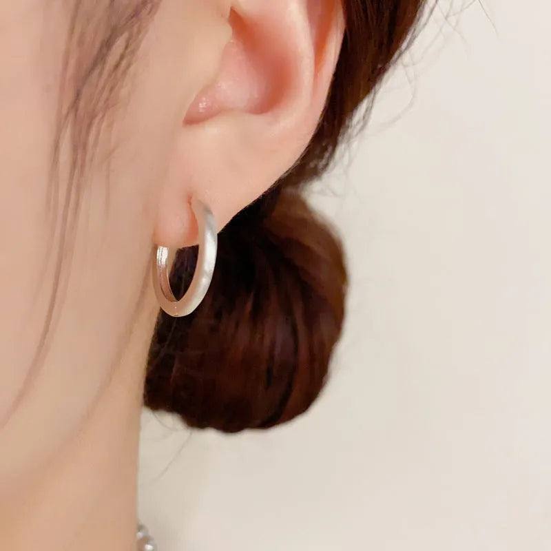 Geometric copper ear clip with round eyelet design in gold plating for women