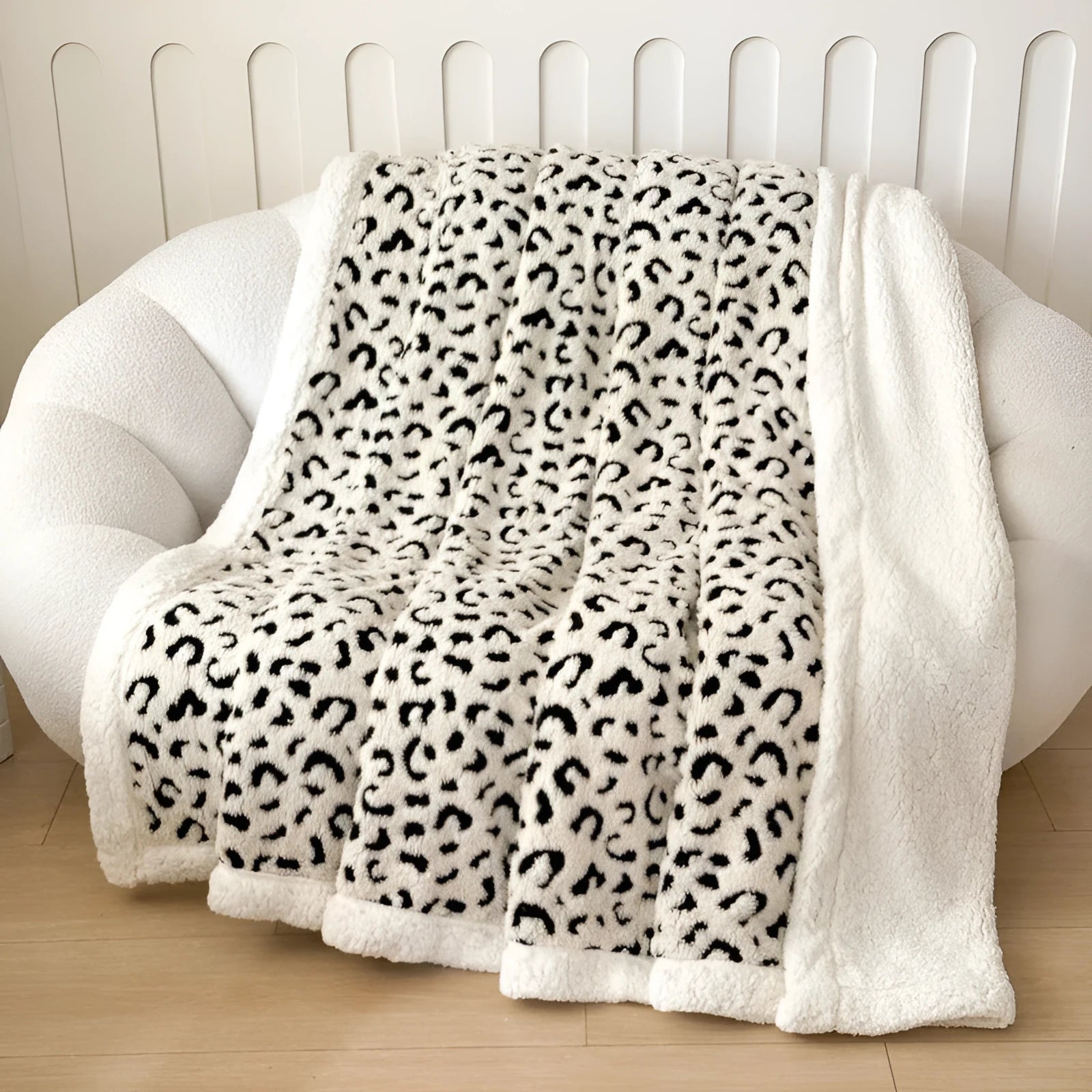 Double-layer cationic leopard jacquard taffeta blanket showing animal print pattern detail