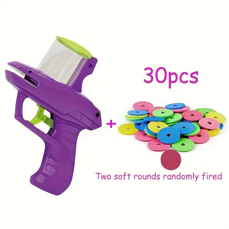 Interactive plastic cat toy launcher with foam disc projectile in green or purple colours