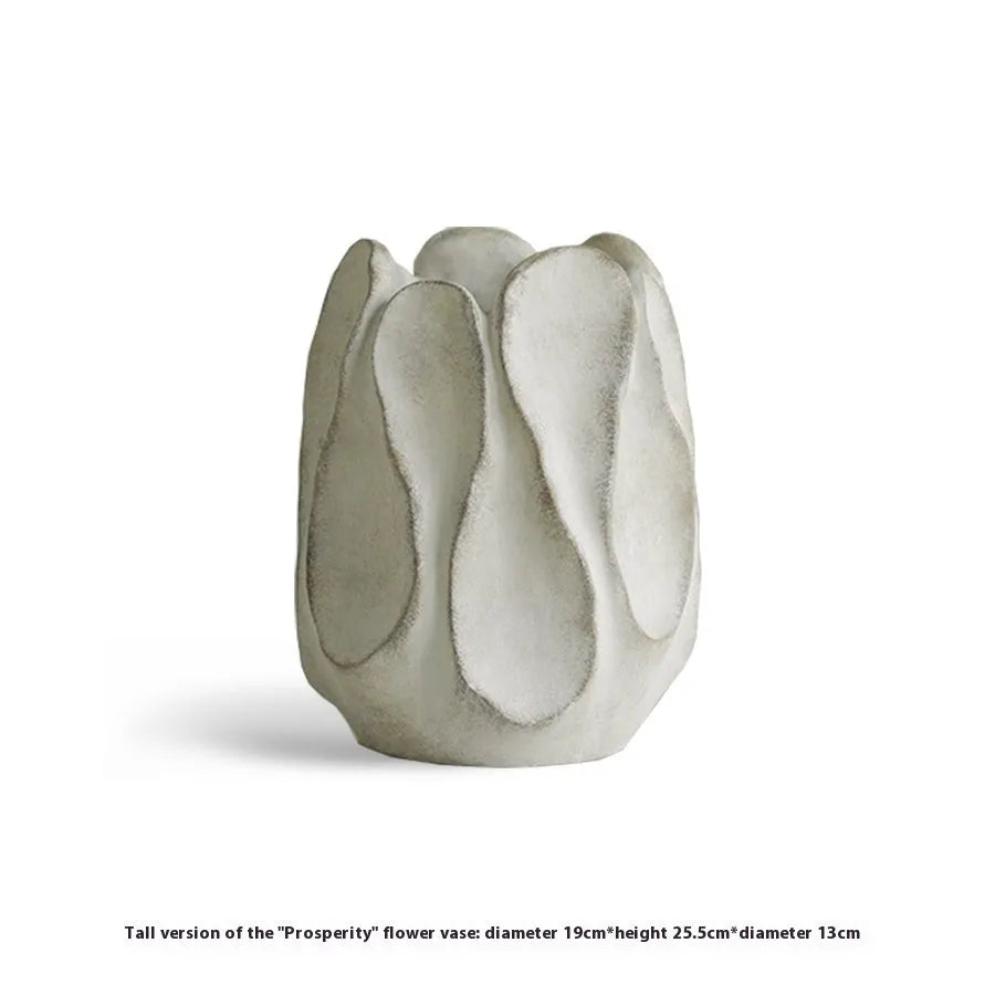 Irregular art ceramic vase in magnesium clay material displayed in high and low style options