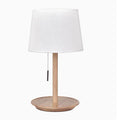 Walnut-coloured solid wood bedside lamp with white cloth shade and cable switch
