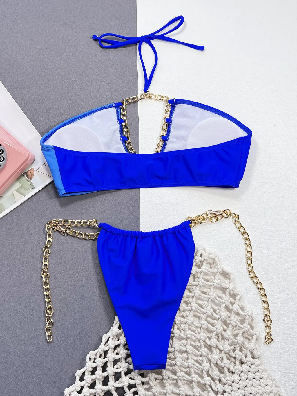 Solid blue women's two-piece nylon bikini swimsuit on a white background.