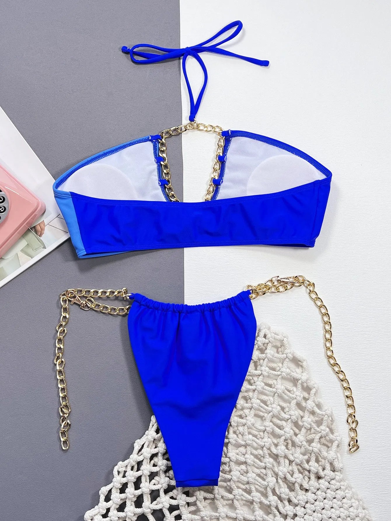 Solid blue women's two-piece nylon bikini swimsuit on a white background.