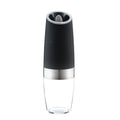 Electric gravity pepper grinder with clear acrylic body and blue LED light on a kitchen countertop