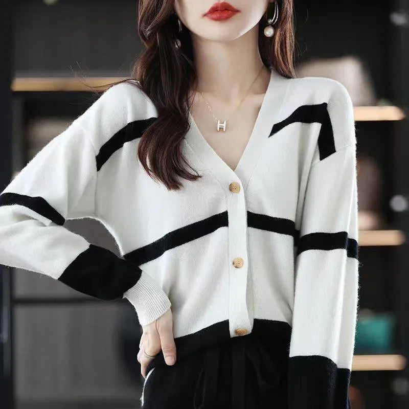 Women's slim fit V-neck cardigan with 3D striped pattern in black and white.