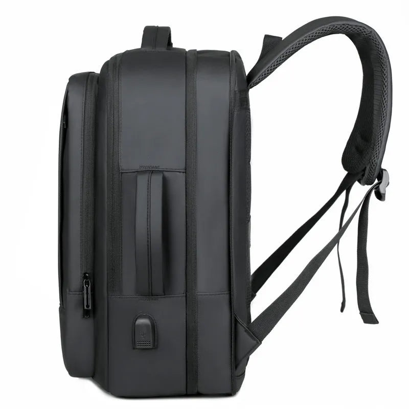 Black waterproof Oxford cloth business backpack with curved shoulder strap showing laptop compartment